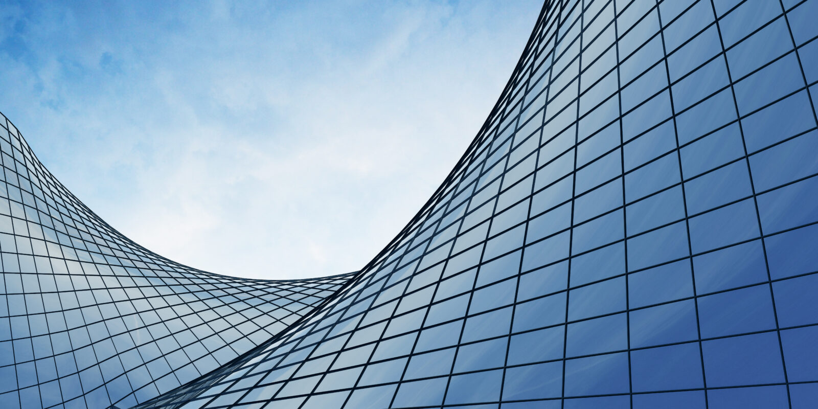 View,Of,The,Clouds,Reflected,In,The,Curve,Glass,Office