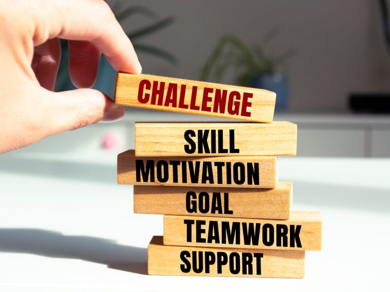 Stacked Wooden Blocks with Words, Challenge, Skill, Motivation, Goal, Teamwork, Support